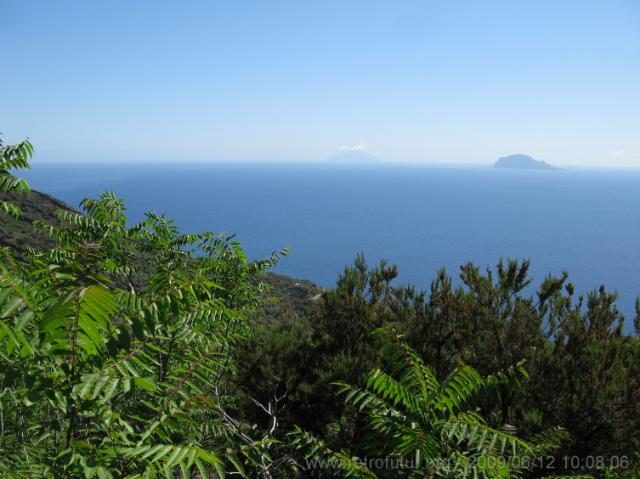 Far away with its peak immersed in a private cloud bath is Stromboli, while closer to the right lies Panarea (47.41 KByte) 12.6: Salina village and ascent of volcano Monte Fosse delle Felci : Far away with its peak immersed in a private cloud bath is Stromboli, while closer to the right lies Panarea